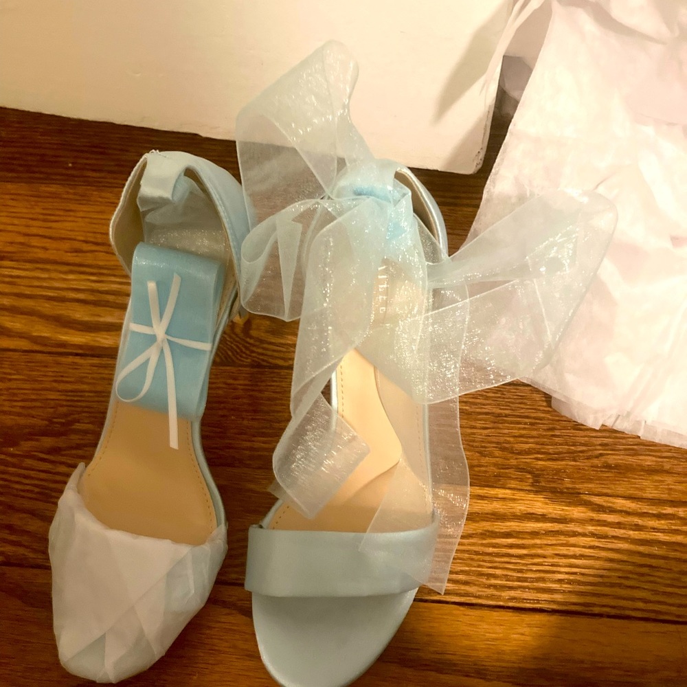 Custom made, size 7.5 baby blue heels with tie on ribbon straps. Never worn